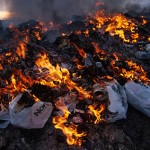 Open trash burning, the garbage contains plastics which when burnt release dangerous dioxins, Churchill, Canada