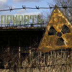 A radioactive sign hangs on barbed wire outside a café in Pripyat.